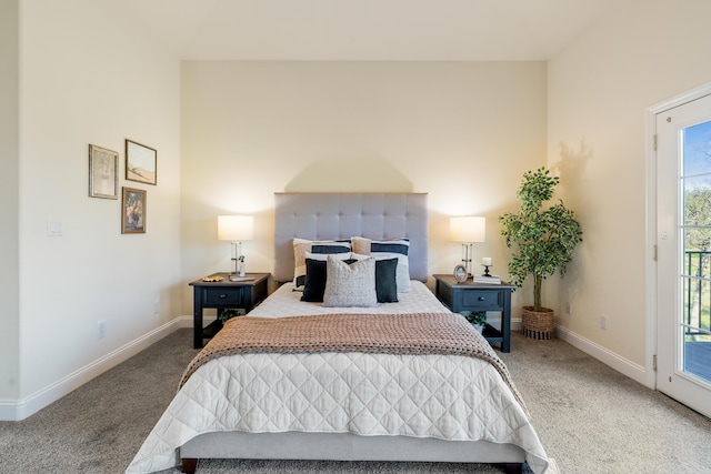 carpeted bedroom featuring access to outside