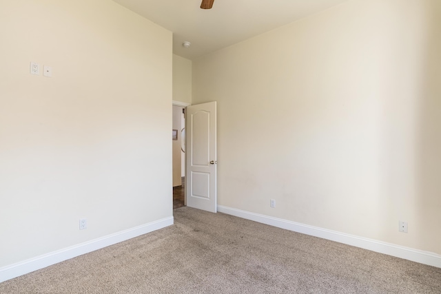 spare room featuring carpet flooring and ceiling fan