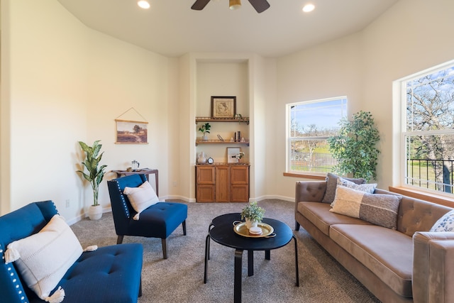 living room featuring light carpet and ceiling fan