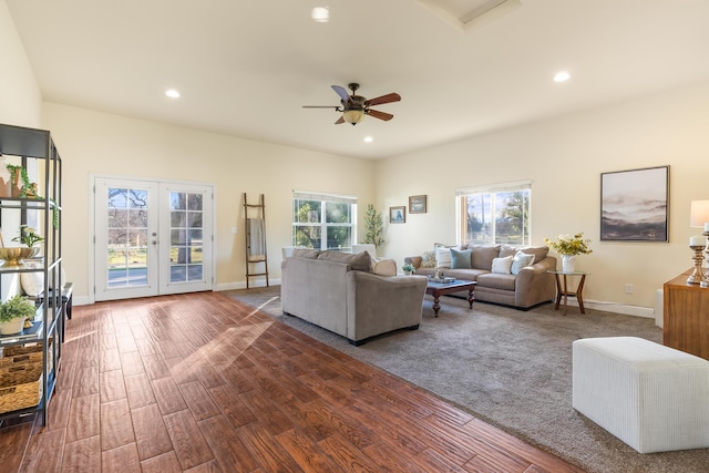 living room featuring ceiling fan, dark hardwood / wood-style flooring, and french doors