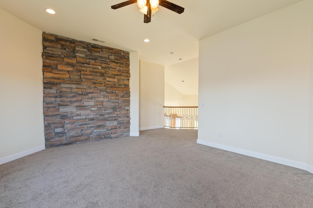 unfurnished room with ceiling fan, carpet, and lofted ceiling