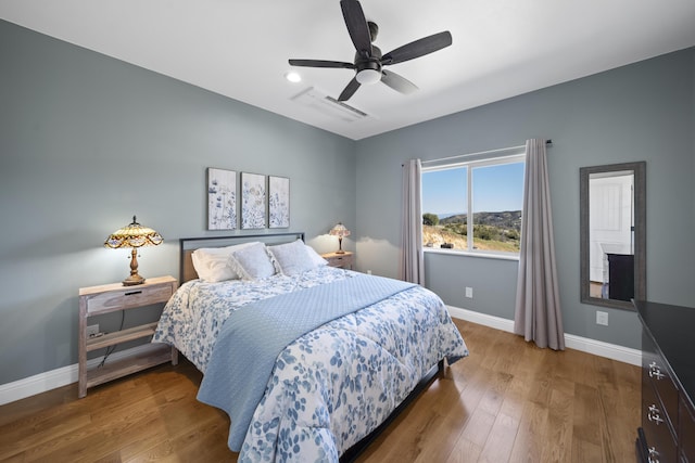 bedroom featuring ceiling fan and hardwood / wood-style flooring