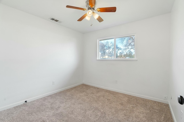 unfurnished room featuring ceiling fan and carpet floors