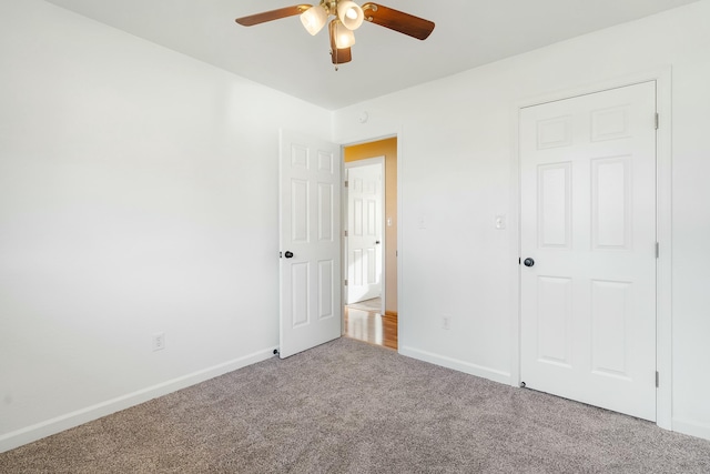 unfurnished bedroom with carpet flooring and ceiling fan