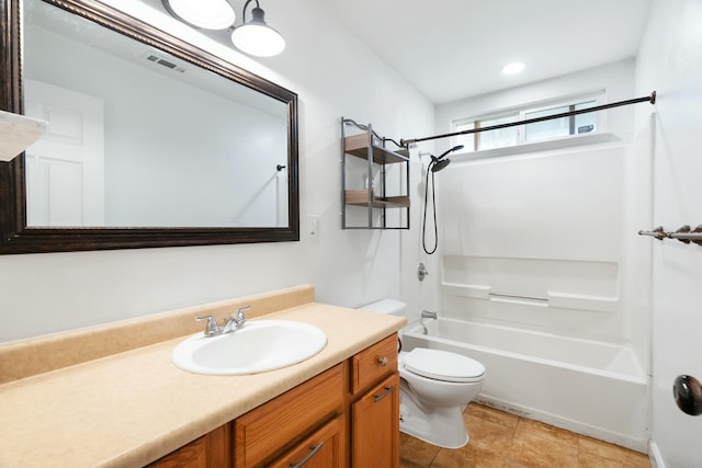 full bathroom with tile patterned flooring, toilet, vanity, and tub / shower combination