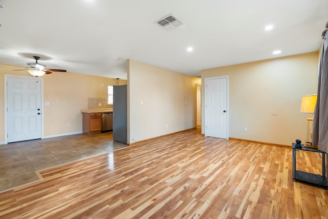 unfurnished living room with ceiling fan and light hardwood / wood-style floors