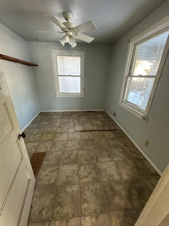 spare room featuring ceiling fan