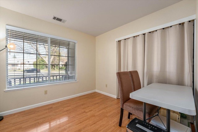 office space with hardwood / wood-style floors