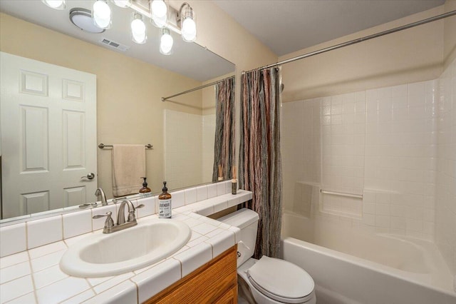 full bathroom with toilet, vanity, and shower / bathtub combination with curtain