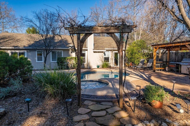 view of pool with a patio area, an in ground hot tub, and a pergola