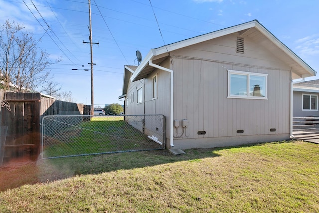 view of property exterior with a lawn