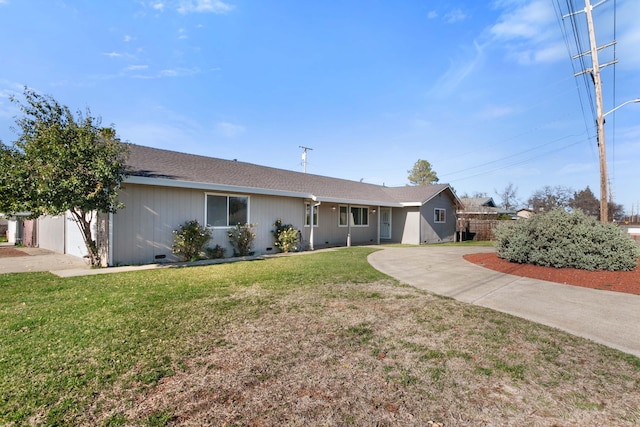 ranch-style house with a front lawn