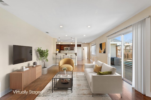 living room with light hardwood / wood-style floors