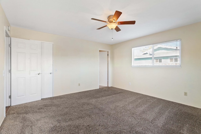 unfurnished bedroom with carpet flooring, ceiling fan, and a closet