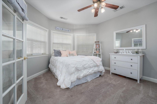 bedroom with ceiling fan and carpet flooring