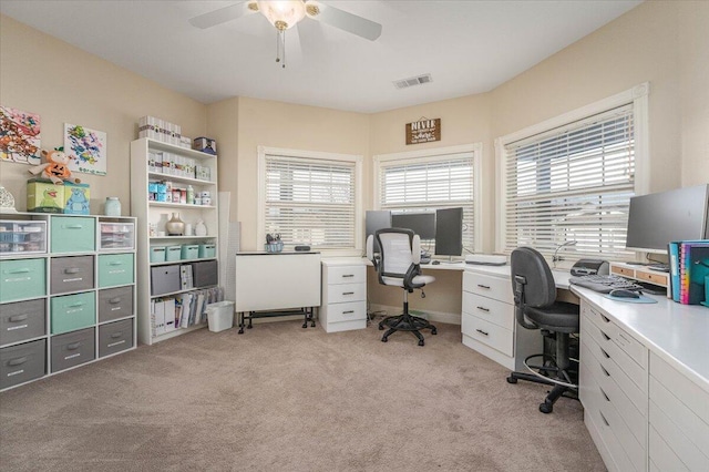 home office with ceiling fan and light colored carpet