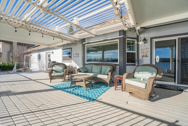 wooden terrace featuring an outdoor hangout area and a pergola