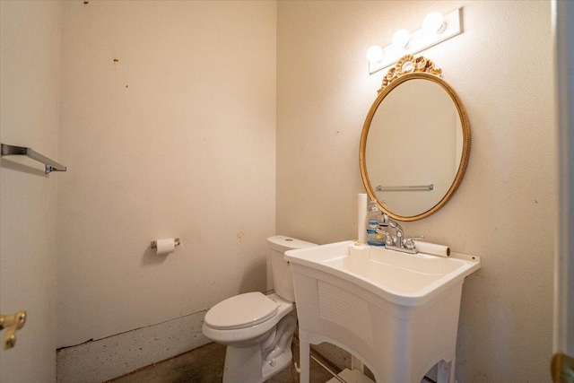 bathroom with toilet and sink