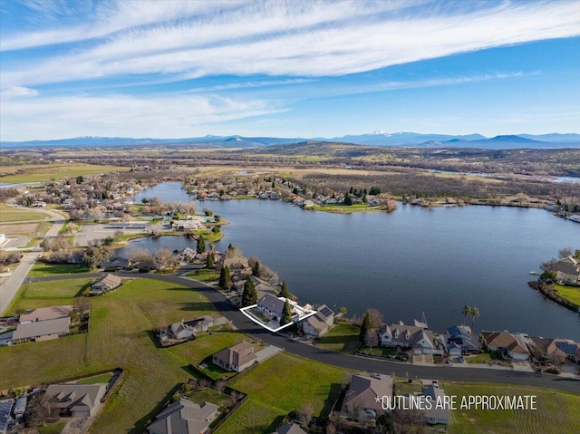 bird's eye view with a water and mountain view