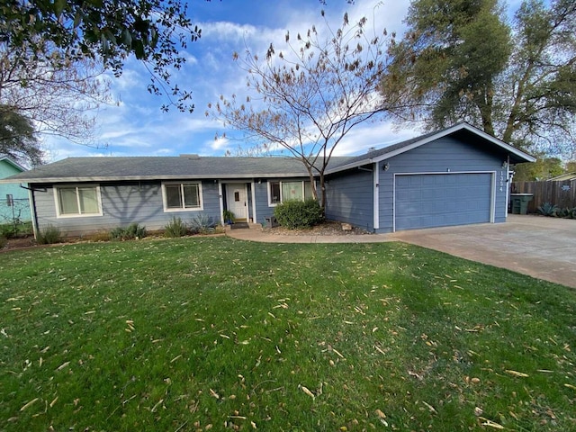 ranch-style home featuring a garage and a front yard