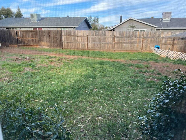 view of yard featuring central AC unit