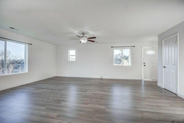 spare room featuring ceiling fan and dark hardwood / wood-style floors