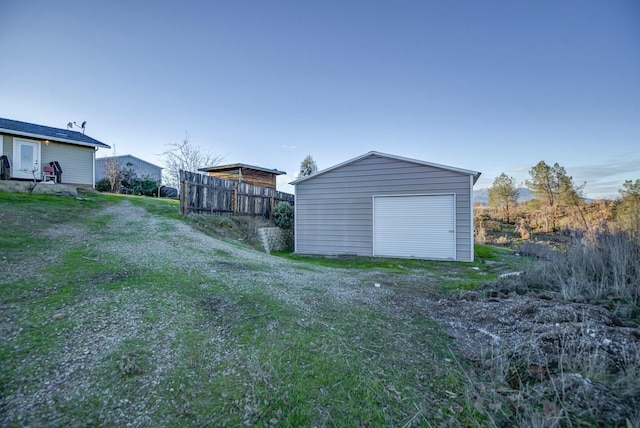 garage featuring a lawn