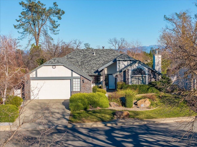 tudor-style house with a garage