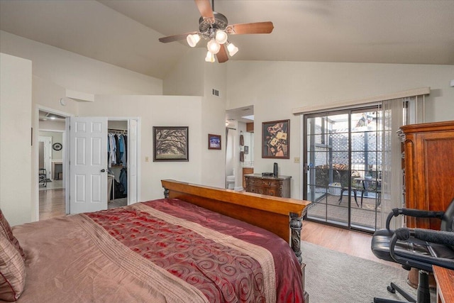 bedroom featuring access to exterior, ceiling fan, vaulted ceiling, and hardwood / wood-style flooring