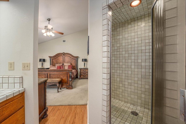 bedroom with light hardwood / wood-style floors and ceiling fan