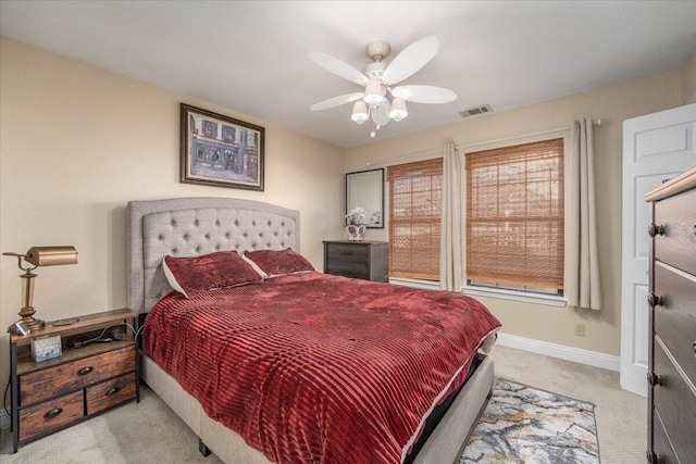 bedroom featuring ceiling fan and light colored carpet