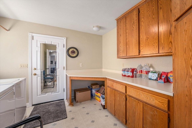 kitchen with washing machine and dryer