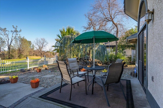 view of patio featuring a water view