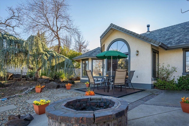 view of patio with a fire pit