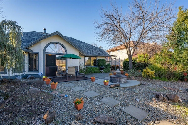 back of property with a patio