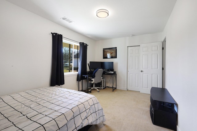 carpeted bedroom featuring a closet