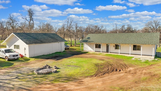 exterior space featuring cooling unit and a front lawn