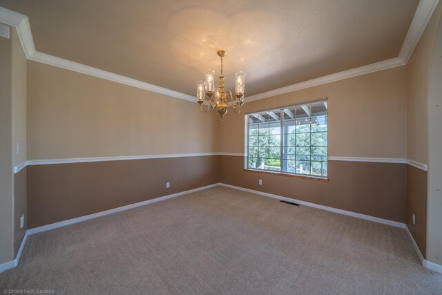 unfurnished room featuring crown molding, carpet floors, and a notable chandelier