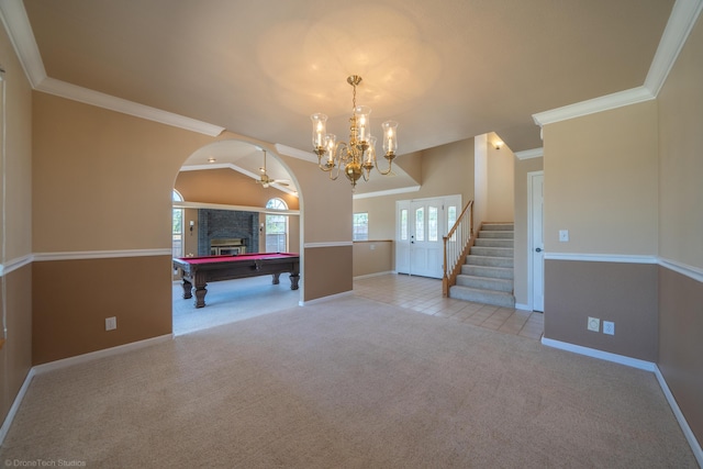 playroom featuring vaulted ceiling, crown molding, light carpet, and ceiling fan with notable chandelier