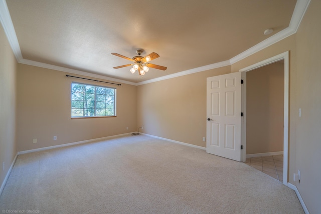 empty room with light carpet, ceiling fan, and ornamental molding