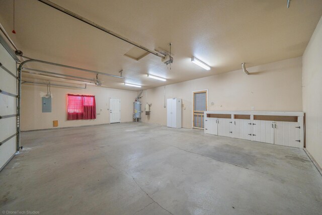 garage featuring secured water heater, electric panel, and a garage door opener