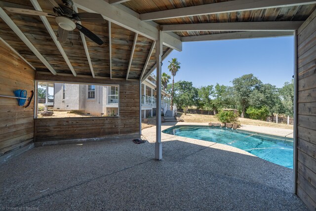 view of swimming pool featuring a patio and ceiling fan