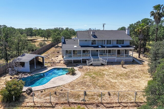 back of house with a wooden deck