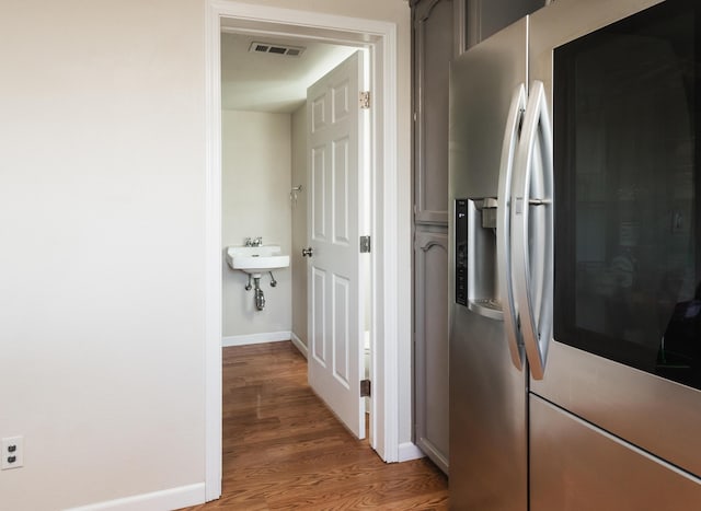 corridor featuring hardwood / wood-style floors