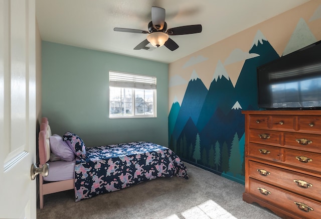 bedroom featuring light colored carpet and ceiling fan