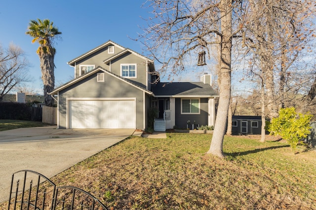 view of front property with a garage and a front yard