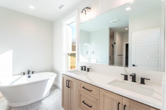 bathroom featuring separate shower and tub and vanity