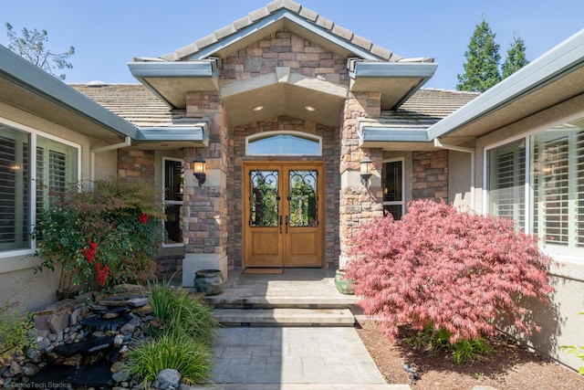 property entrance featuring french doors