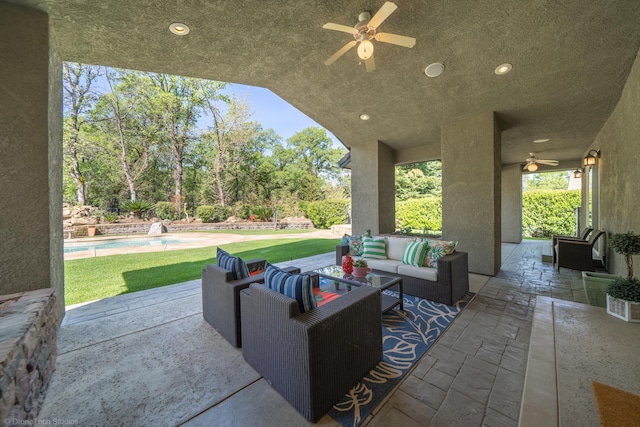 view of patio / terrace with an outdoor living space and ceiling fan