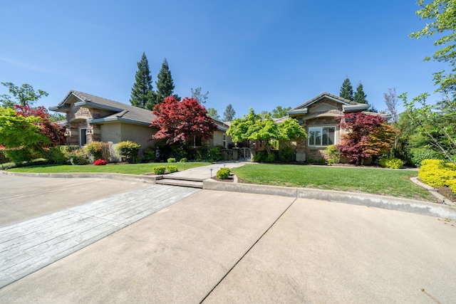 obstructed view of property featuring a front yard